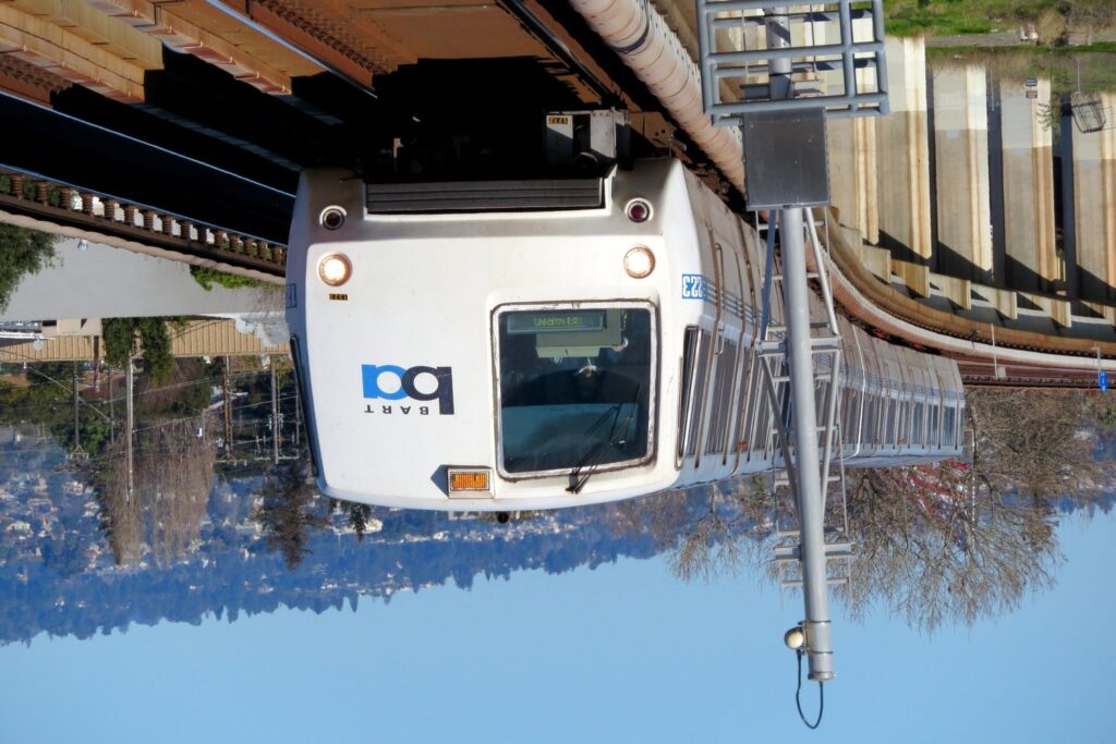 BART train upside down on tracks.