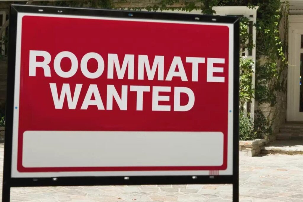 Roommate wanted sign in front of house.