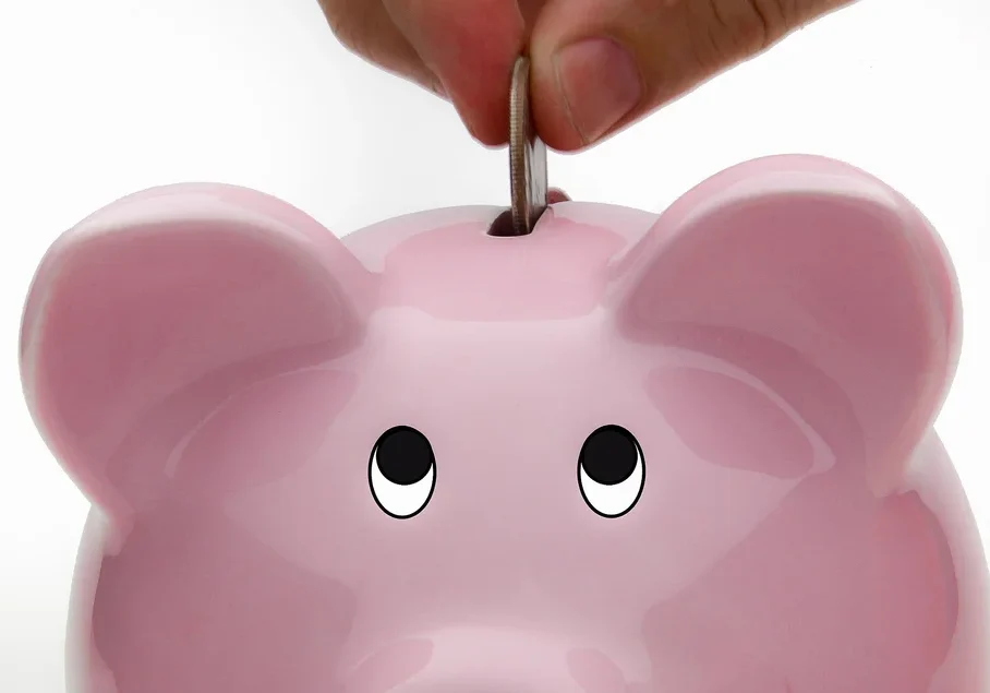 2048px-Deposit_Into_Piggy_Bank_Savings_Account_(6093700157)