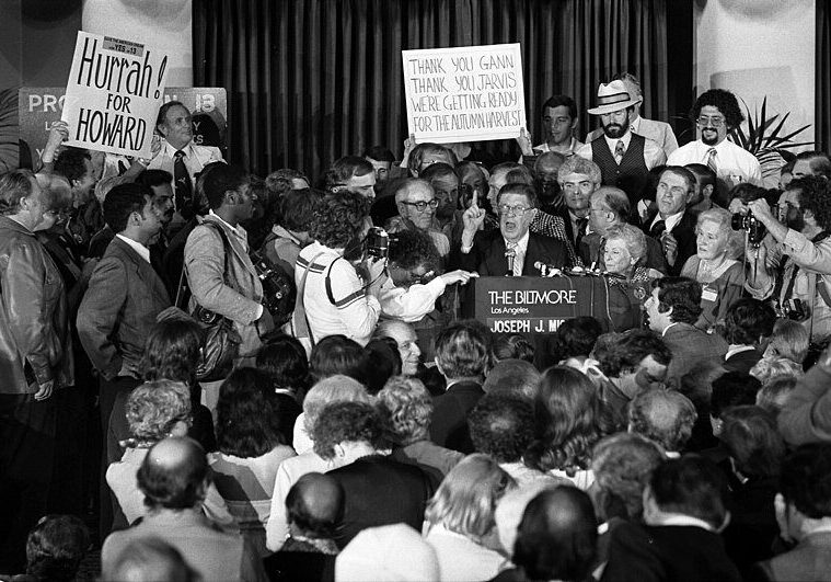 Black and white photo of a political rally.