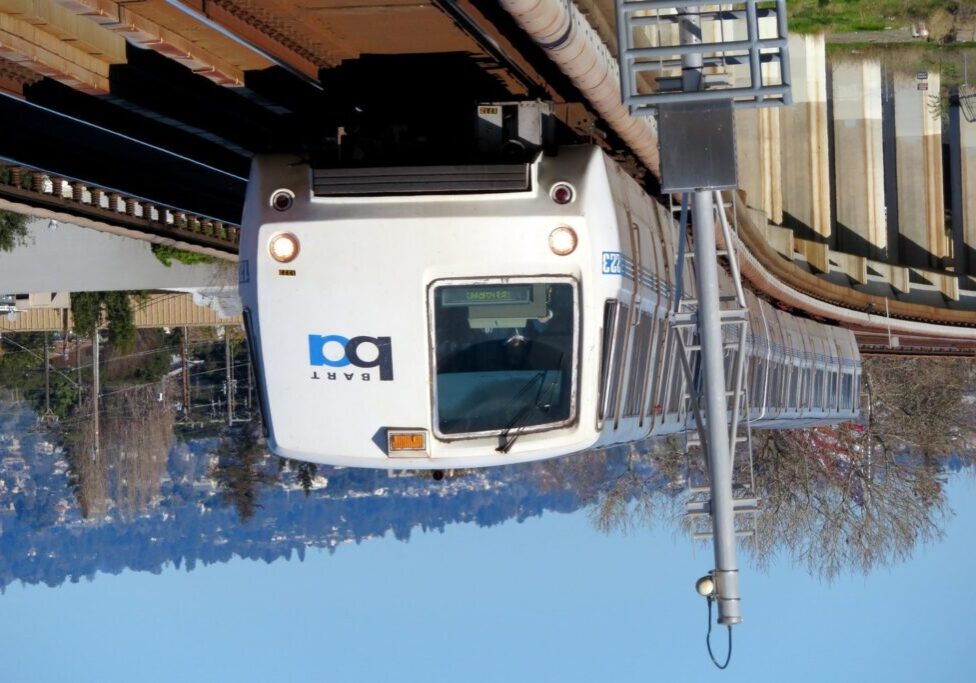 BART train upside down on tracks.