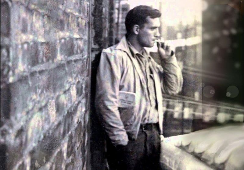 Black and white photo of man smoking.