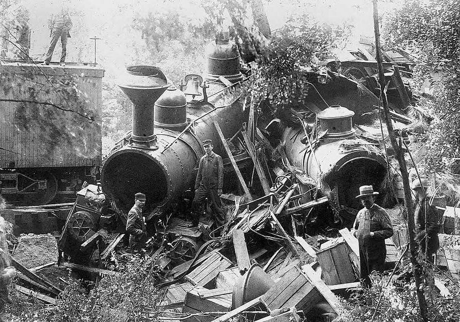 Black and white photo of a train wreck.