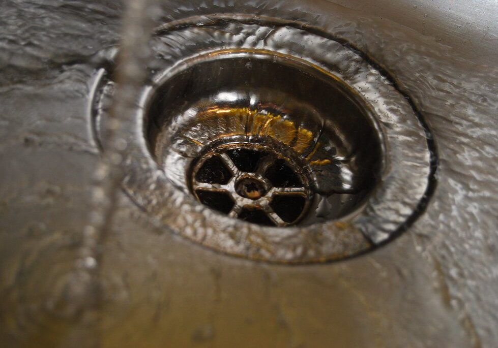 Water draining in a kitchen sink.